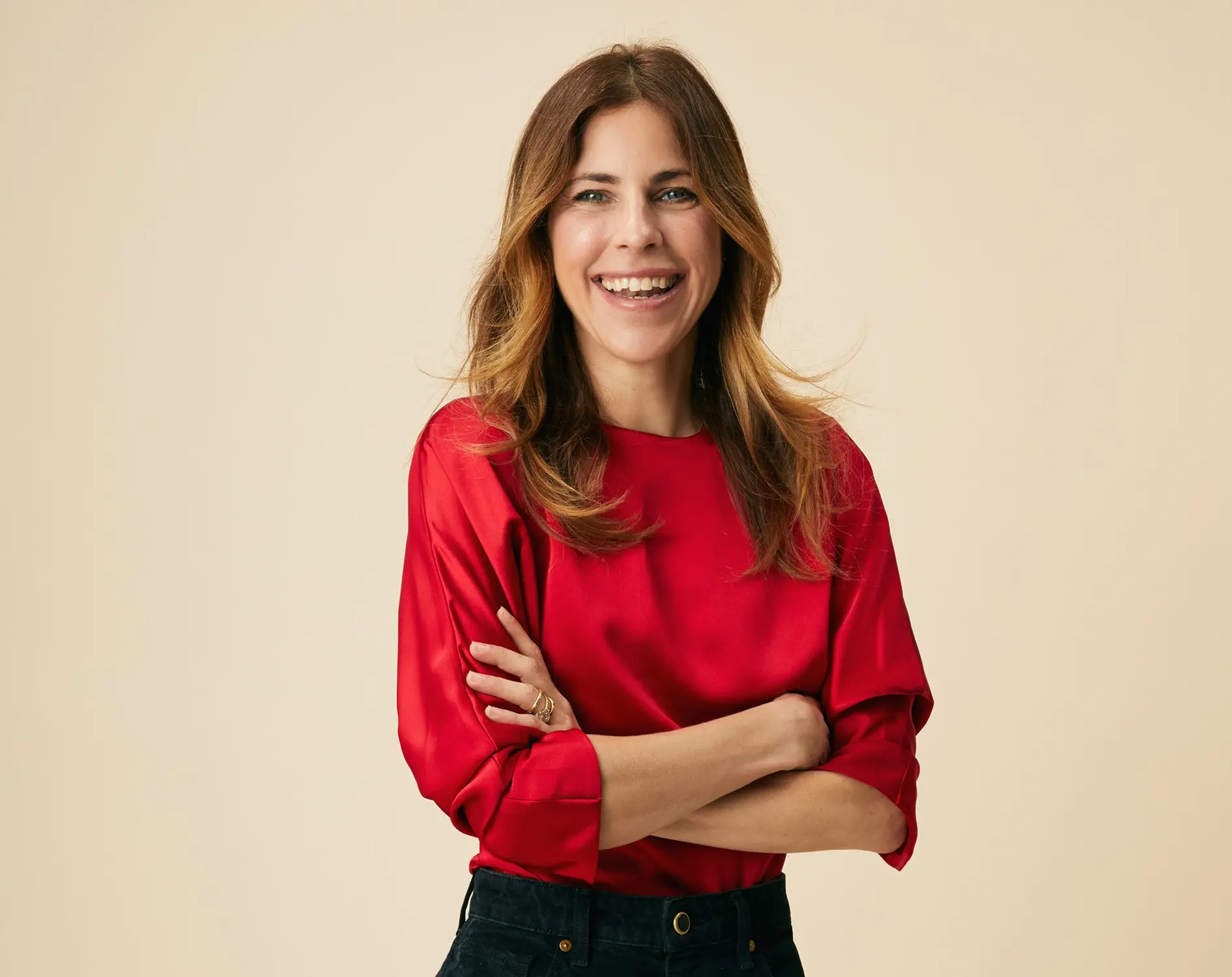 Dr. Robin Berzin in red blouse smiling at camera