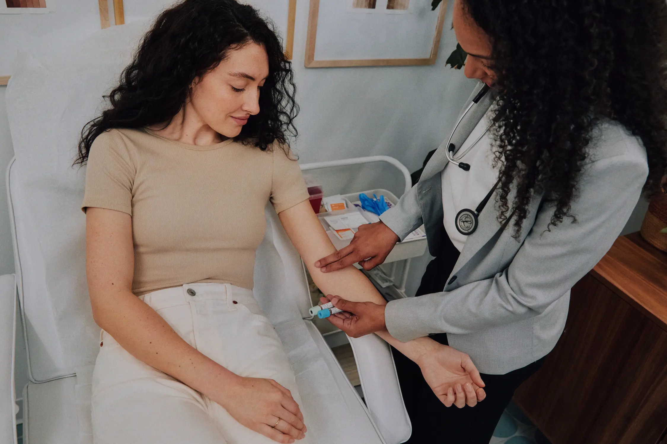 Doctor taking lab blood draw