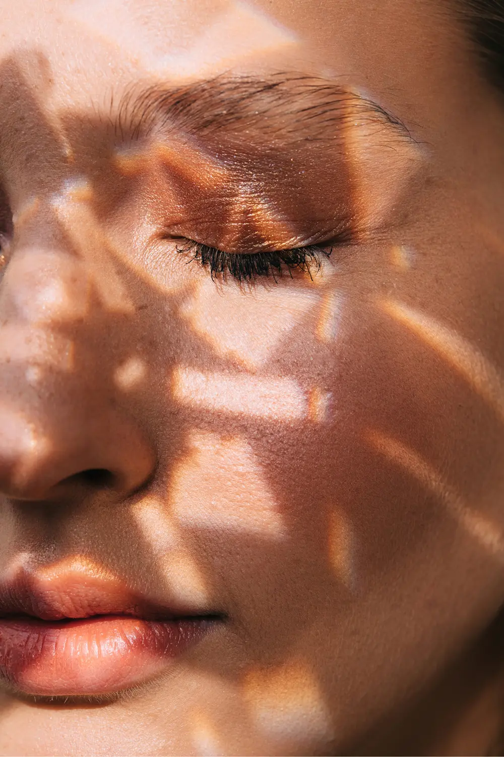 Woman with eyes closed and shadows